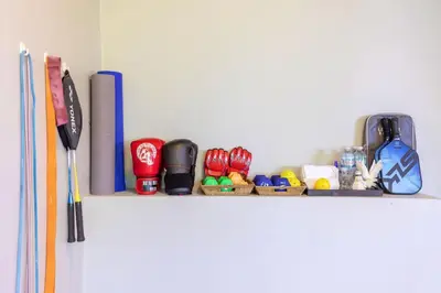 a white shelf with pens and other items on it at Villa Leelawadee in Por Bay