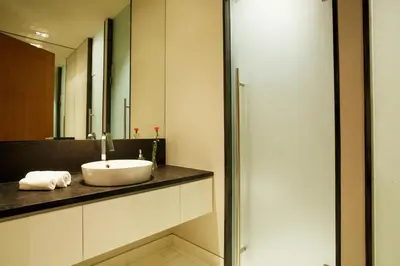 a bathroom with a sink and a mirror at Villa Paradiso in Nai Thon Beach