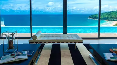 a living room with a view of the ocean at Villa Paradiso in Nai Thon Beach