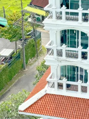 an overhead view of a white building with a red roof at Grand Supicha City Hotel in Phuket Town
