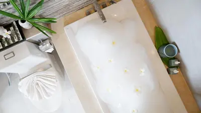 an overhead view of a bathtub with stars on the floor at Ozone Villa Phuket in Ban Pa Khlok