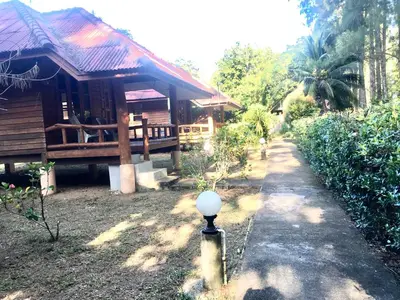 a house with a street light in front of it at Namtok Bungalows in Ko Yao Noi