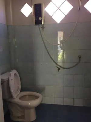 a bathroom with a toilet and a shower at Namtok Bungalows in Ko Yao Noi