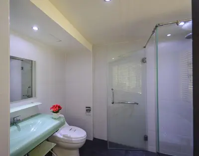 a bathroom with a shower and a toilet and a sink at BeststayinPhuket Mountain Poolviews in Patong Beach