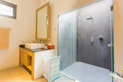 a bathroom with a shower and a sink at Honeymooner Pool Villa@Seastone in Bang Tao Beach