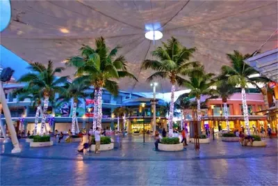 a shopping center with palm trees in a mall at Bliss Patong 2 bedrooms Apartment in Patong Beach