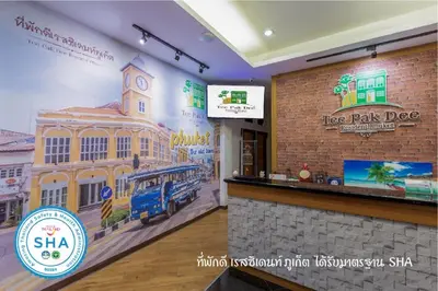 a restaurant with a mural of a tree park dog at Tee Pak Dee Resident Phuket in Phuket Town