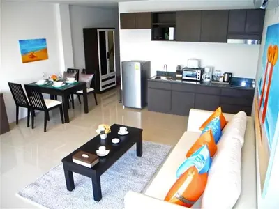 a living room with a couch and a table at Patong Bay Hill 1 bedroom Apartment in Patong Beach
