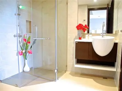 a bathroom with a shower and a sink and a toilet at Emerald Patong 1 bedroom Modern Apartment in Patong Beach