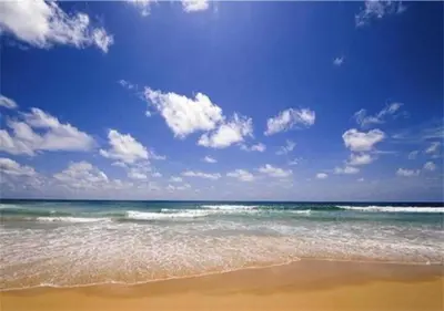 a beach with the ocean and a blue sky and clouds at Chic Karon Nice Apartment close to Karon Beach in Karon Beach