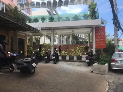 a group of motorcycles parked in front of a building at Baan Petcharat in Patong Beach