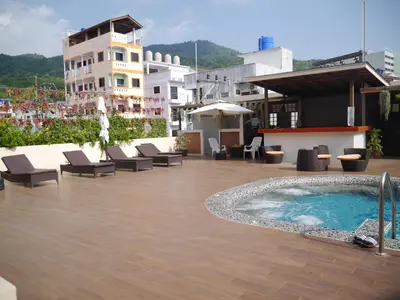 a swimming pool on the roof of a building at Baan Petcharat in Patong Beach