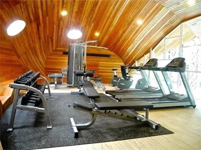 a gym with several tread machines in a room at Emerald Patong New Studio with Balcony in Patong Beach