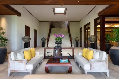 a living room with two couches and a coffee table at Andara Resort Villas in Kamala Beach