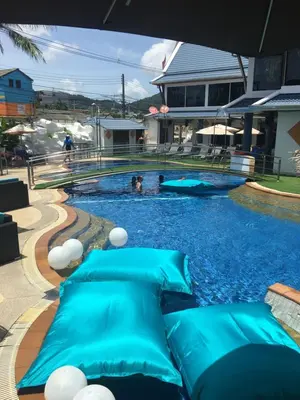 a swimming pool with blue inflatables in a house at The Yorkshire Hotel - SHA Certified in Patong Beach