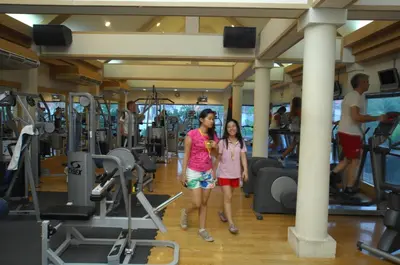 two women standing in a gym at The Yorkshire Hotel - SHA Certified in Patong Beach