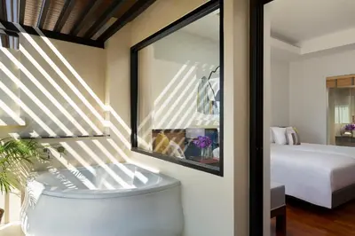 a room with a bed and a window at Avani Ao Nang Cliff Krabi Resort in Ao Nang Beach
