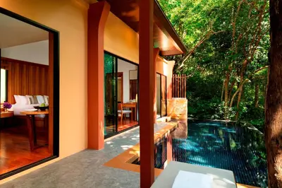 an external view of a house with a swimming pool at Avani Ao Nang Cliff Krabi Resort in Ao Nang Beach