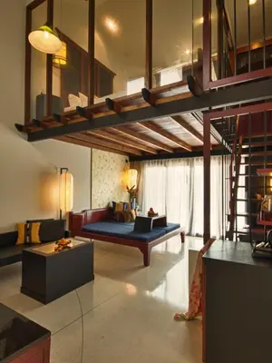 a living room with a couch and a table at Red Ginger Chic Resort in Ao Nang Beach