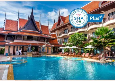 a swimming pool in front of a hotel at Nipa Resort, Patong Beach in Patong Beach