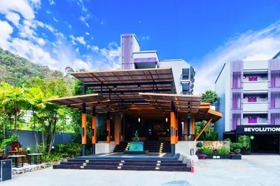 a building with awning in front of a building at Phuvaree Resort in Patong Beach