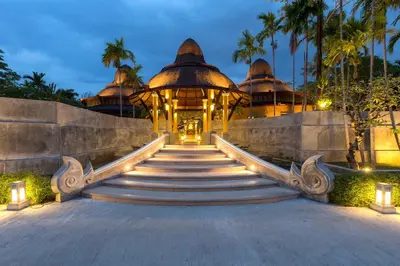 a set of stairs leading to a building at The Village Resort - SHA Plus in Karon Beach