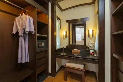 a bathroom with a sink and a mirror at The Village Resort - SHA Plus in Karon Beach