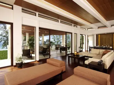 a living room with a couch and a table at Mövenpick Resort Bangtao Beach Phuket in Bang Tao Beach