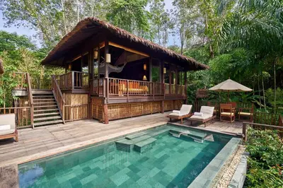 a villa with a pool and a house at Six Senses Yao Noi in Ko Yao Noi