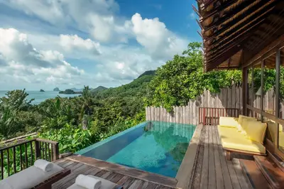 a villa with a pool and a deck with a view at Six Senses Yao Noi in Ko Yao Noi