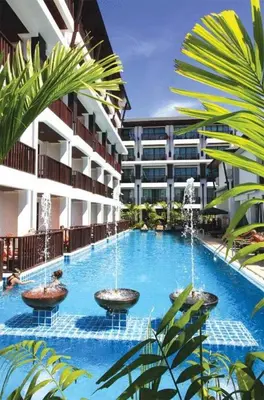 a swimming pool with fountains in the middle of a building at Apasari Krabi - SHA Extra Plus in Ao Nang Beach