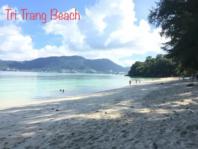 a view of a beach with people in the water at Q Victory Patong Hotel in Patong Beach