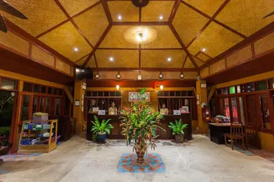 a lobby of a store with potted plants in it at PP Erawan Palms Resort in Phi Phi Don