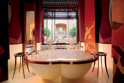 a large bathroom with a large tub in a room at Phulay Bay, a Ritz-Carlton Reserve in Tab Kaek Beach
