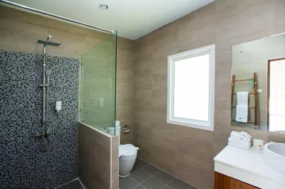 a bathroom with a shower and a toilet and a sink at Baan Anna in Ao Nang Beach