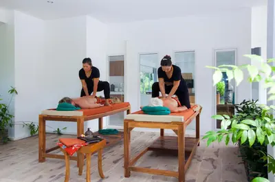 a woman sitting on a bed in a room at Baan Anna in Ao Nang Beach