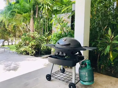 a bbq grill with a helmet on top of it at Baan Lalle in Ao Nang Beach
