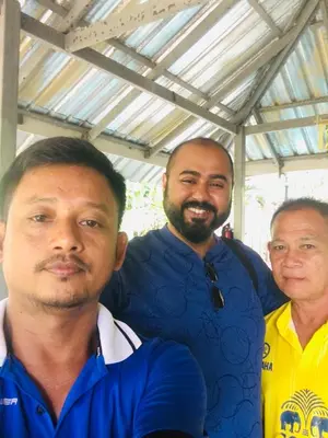 a group of three men standing next to each other at Sea View Bungalow in Phi Phi Don