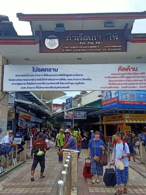 a group of people walking through a market at Sea View Bungalow in Phi Phi Don