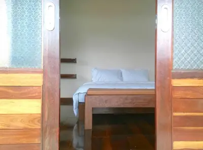 a bedroom with a bed in a room at Lantala Residence in Natai Beach