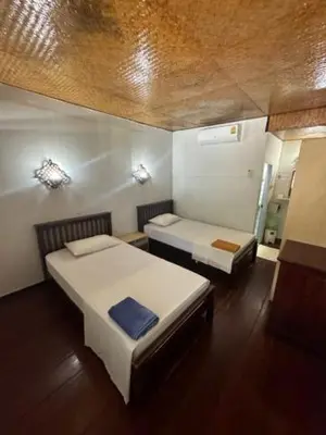 a room with two beds in a room at Lux Guesthouse in Phi Phi Don