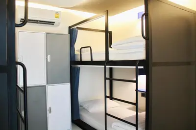 a group of bunk beds in a room at BearPacker Patong Hostel in Patong Beach