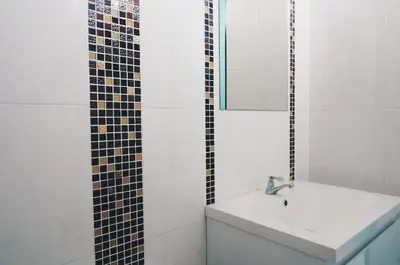a bathroom with a sink and a mirror at Phuket Best Travel in Nai Yang Beach
