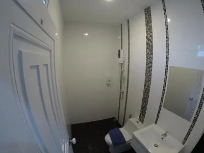 a small bathroom with a toilet and a sink at Phuket Best Travel in Nai Yang Beach