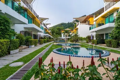 a courtyard of a building with a swimming pool at AP Grand Residence by Lofty in Kamala Beach