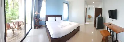 a bedroom with a bed and a balcony at Krabi Lighthouse @ Aonang in Ao Nang Beach