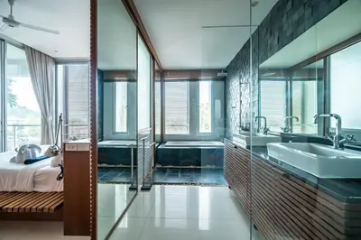 a bathroom with two sinks and a tub at The Quarter by Lofty in Surin Beach