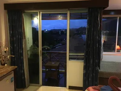 a sliding glass door with a view of the city at Casa E Mare in Kata Beach