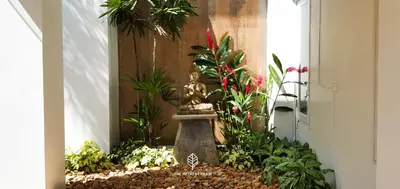 a garden with a statue in the middle of a room at The Retreat Ao nang Private Pool Villa in Ao Nang Beach