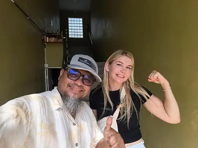 a man and a woman giving the thumbs up at Bangtao Mango House in Bang Tao Beach